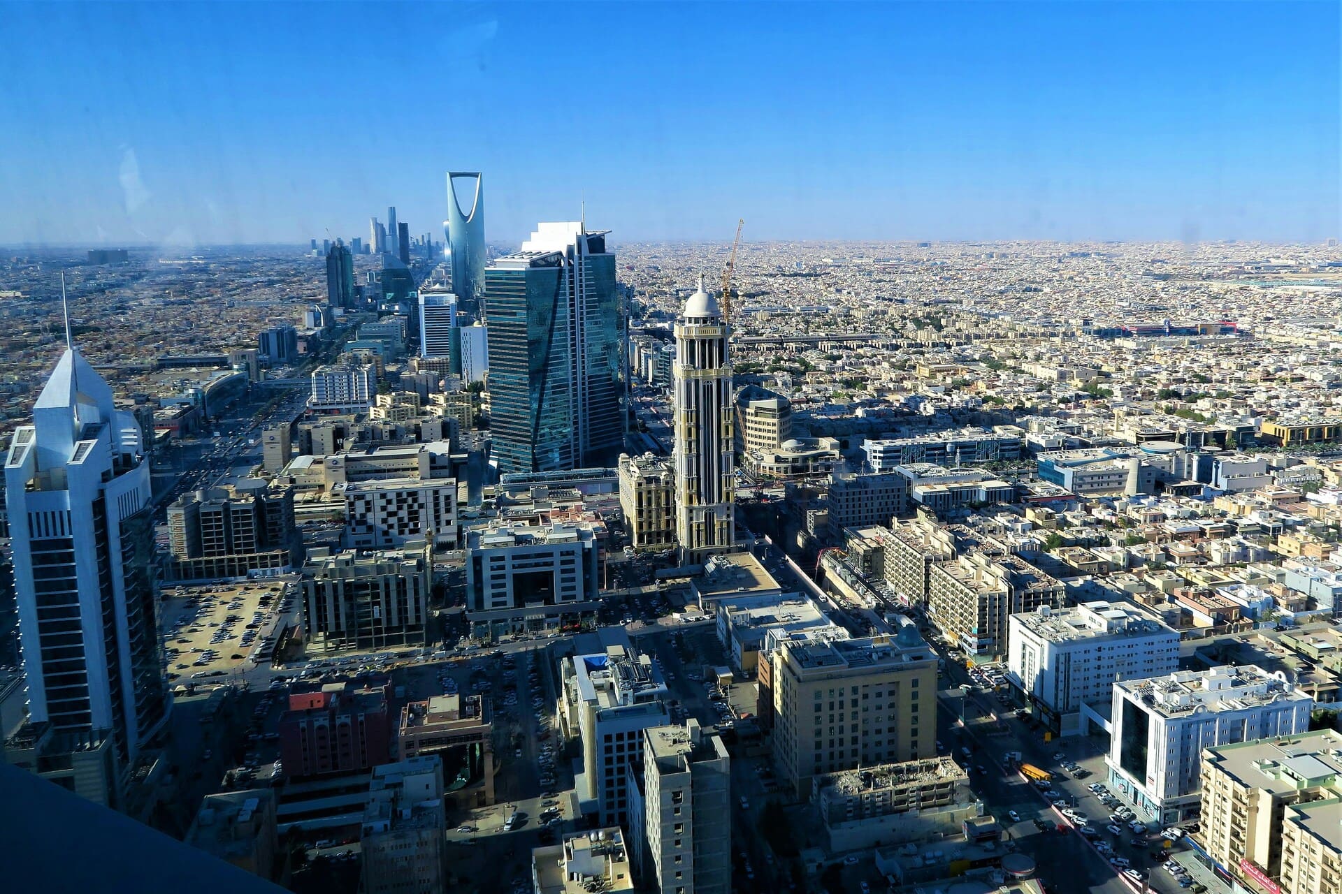A modern residential building in Saudi Arabia under a clear sky.